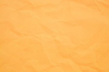 Fototapeta premium Warm orange paper texture background with copy space
