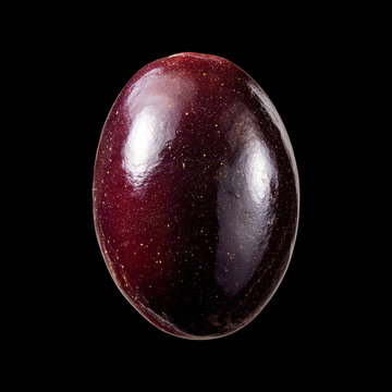 Black Kalamata olives, glossy and plump isolated on black background with clipping path