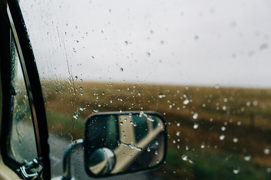 Rainy day road trip view from a car window