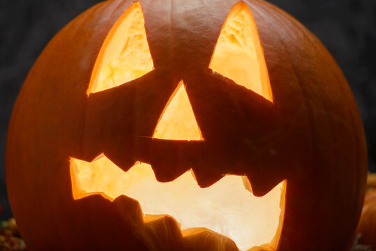 Glowing Jack O Lantern With Smoke on Dark Halloween Background