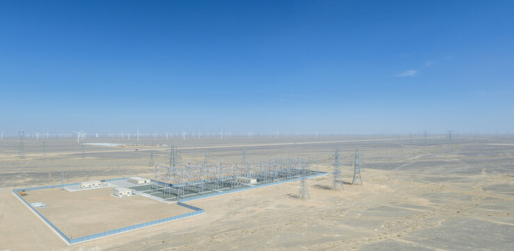 Aerial Panorama of Desert Substation Near Wind Farm and Storage Station