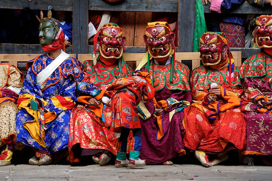 Bhutan, In the village of Bumthang, monks in colorful costumes with beautiful maskduring the annual Jakar festival.
