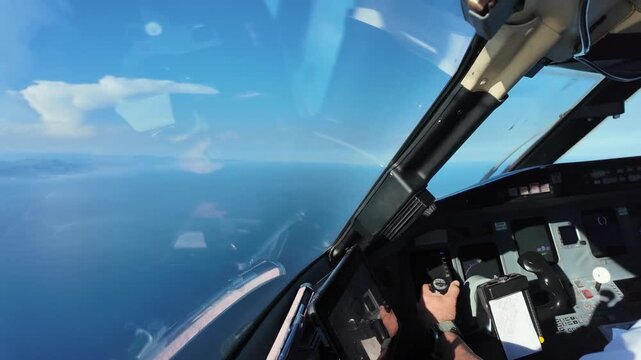 Immersive pilot&rsquo;s view in a real time flight approaching to Nice airport, with a view of the left hand of a caucasian pilot flying manually doing a left turn over the Mediterranean sea
