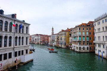 The city of Venice and the view of the Grand  Canal with ferry boat, gondola and water taxi from Rialto bridge  © PaBou