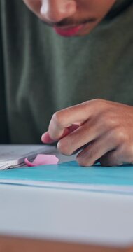 Person, hands and student with note in classroom for private message, confidential or secret. Academic, learner or piece of paper with answer or question for cheating exam, test or school assessment