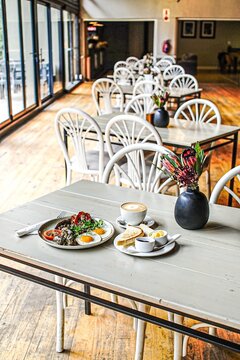 Full breakfast meal served on a table in a rustic cafe