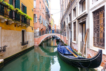 City of Venice, canal, boats, gondola and alley street with colorful buildings and houses  © PaBou
