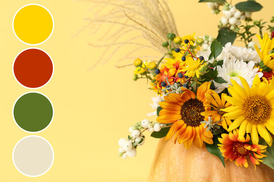 Autumn floral arrangement with sunflowers and chrysanthemums in a pumpkin vase, fall color palette on yellow background, a complementary color palette