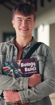 Happy, high school and face of boy with textbook in corridor for learning, education and biology course. Portrait, student and teenager with books for lesson, development and science at academy