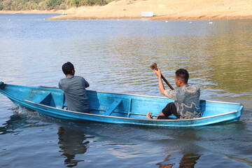 Rowing Team Training on a Lake for Indonesian Independence Day Competition © Nawassyarif .