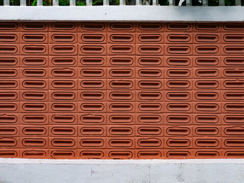 Terracotta Perforated Brick Wall Pattern with White Concrete Border