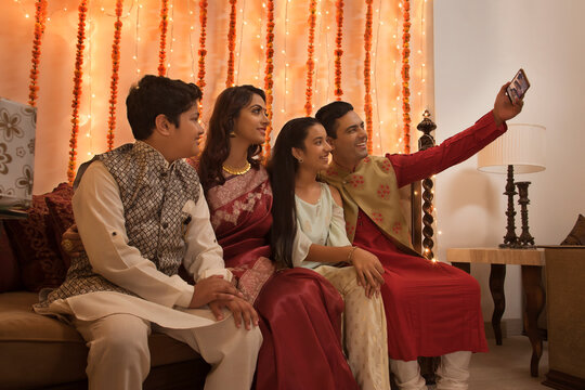 family clicking selfie together on diwali