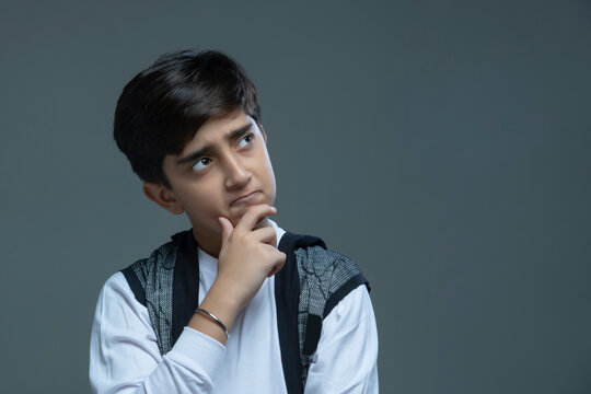 Portrait of a young boy thinking (Children)