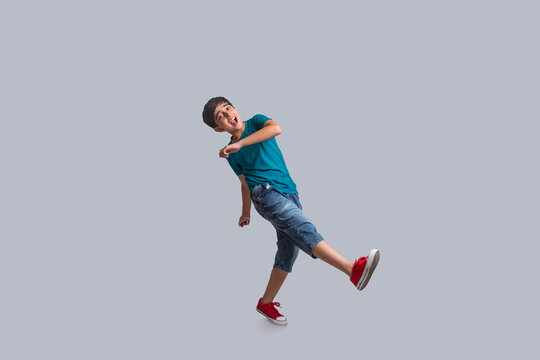 Portrait of a happy young boy dancing (Children)