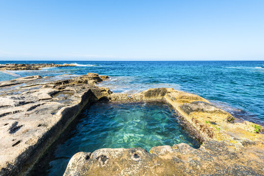 Natural &ldquo;Roman Baths&rdquo; rock pools in Sliema feature clear turquoise water surrounded by rugged coastal formations, offering a scenic Mediterranean spot for swimming, relaxing, and enjoying the shore