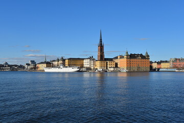 Fototapeta premium Stockholm skyline in Sweden showcasing Scandinavian architecture and the historic Gamla Stan, featuring medieval buildings, narrow cobblestone streets, and a picturesque cityscape