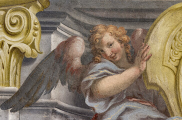 Fototapeta premium CREMA, ITALY - MARCH 20, 2026: The fresco of baroque angel the church Santuario di Santa Maria della Croce by brothers Giuseppe and Giovanni Antonio Torricell from year 1762