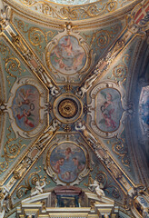 Fototapeta premium MONZA, ITALY - MARCH 19, 2026: The baroque stucco and frescoes of angels on the ceiling of side nave of Cathedral by Carlo Innocenzo Carloni from frist part of 18. cent. 