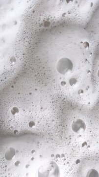 Macro view of white soap foam bubbles with rich cleansing lather texture, abstract skincare background featuring airy suds for hygiene, beauty, wellness and cosmetic product advertising