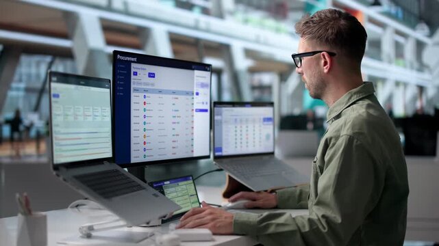 Procurement Manager Reviews Supplier Contracts Using Laptop