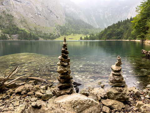 Mountain Lake with Zen Stone in a Peaceful Natural Landscape &ndash; Meditation and Mindfulness Concept