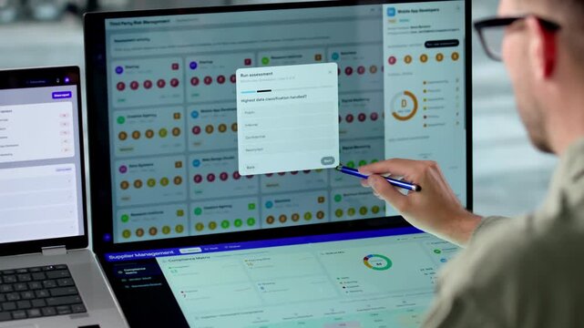 Risk Manager Carefully Reviewing Vendor Data On Laptop