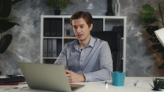 Friendly businessman has online video call, persuading clients to hire his firm
