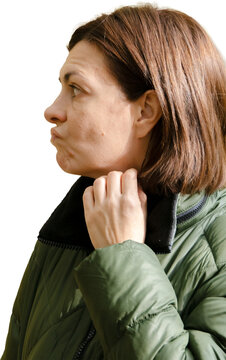 Thoughtful Mid-Adult Woman in Profile Wearing Green Quilted Jacket Isolated on White Background