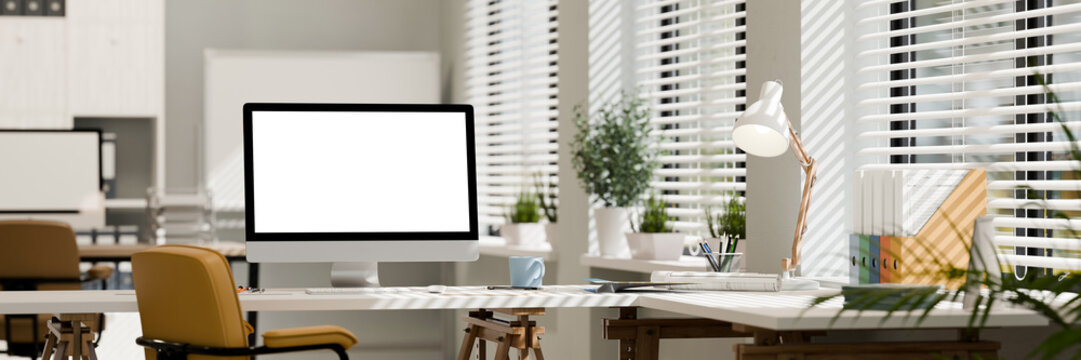 3D Illustration of Modern Office Workspace with Desktop Computer Blank Screen and Natural Light