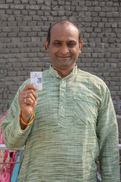 Portrait Of Indian Man Showing Identity Card
