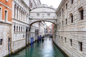 The bridge of sighs and the city of Venice with canal street, bridge, boats, gondola and colorful local buildings and houses  © PaBou