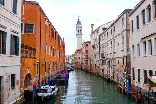 City of Venice, canal, boats, gondola and alley street with colorful buildings and houses 
