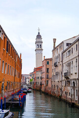 City of Venice, canal, boats, gondola and alley street with colorful buildings and houses  © PaBou
