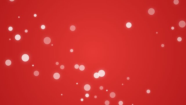 Floating white bokeh particles on a vibrant red background