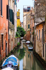 City of Venice, canal, bridge, gondola boats, alley and colorful local buildings and houses  © PaBou