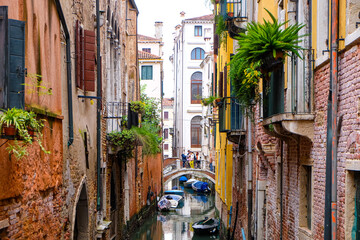 City of Venice, canal, bridge, gondola boats, alley and colorful local buildings and houses  © PaBou