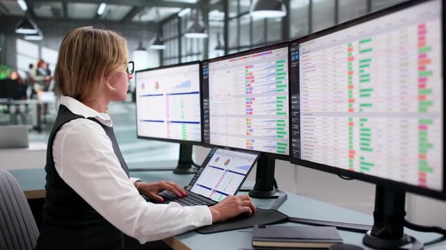 Medical Billing Coder Carefully Reviews Codes On Laptop