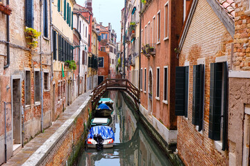 City of Venice, canal, bridge, gondola boats, alley and colorful local buildings and houses  © PaBou