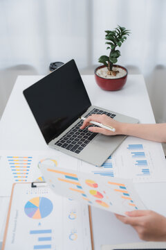 Business financing accounting banking concept. Business woman hand doing finances and calculate on desk about cost at home office. Woman working on desk with using calculator, finance accounting.	