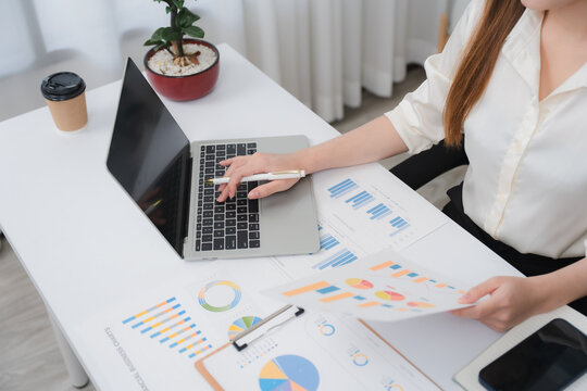 Business financing accounting banking concept. Business woman hand doing finances and calculate on desk about cost at home office. Woman working on desk with using calculator, finance accounting.	