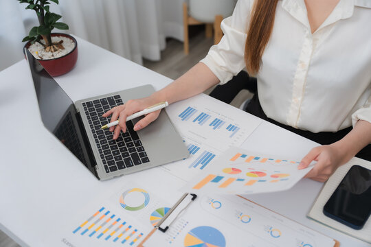 Business financing accounting banking concept. Business woman hand doing finances and calculate on desk about cost at home office. Woman working on desk with using calculator, finance accounting.	