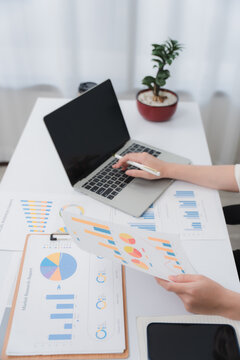 Business financing accounting banking concept. Business woman hand doing finances and calculate on desk about cost at home office. Woman working on desk with using calculator, finance accounting.	