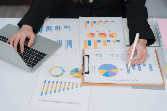 Business financing accounting banking concept. Business woman hand doing finances and calculate on desk about cost at home office. Woman working on desk with using calculator, finance accounting.	