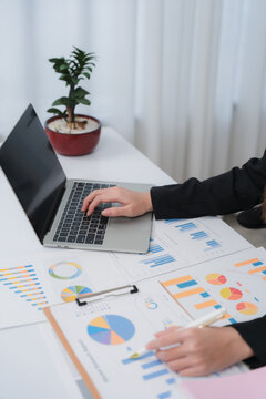 Business financing accounting banking concept. Business woman hand doing finances and calculate on desk about cost at home office. Woman working on desk with using calculator, finance accounting.	