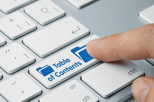 Finger pressing table of contents key on keyboard.