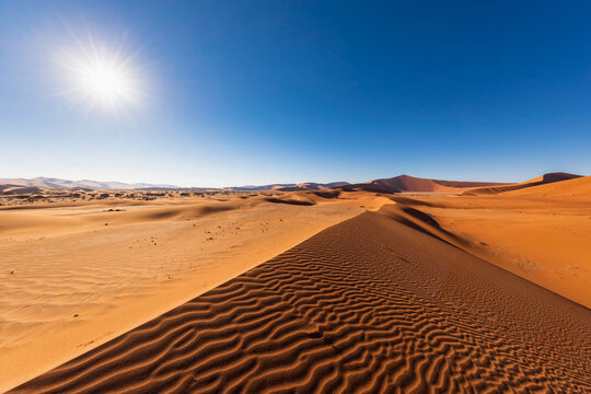 Africa, Namibia, Namib desert, Naukluft National Park, sand dunes against the sun