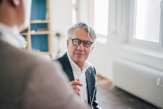 Senior businessman with partner in office