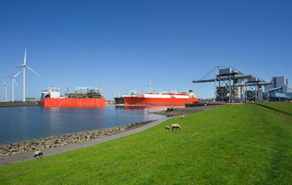 An LNG tanker docks at an industrial port in Eemshaven