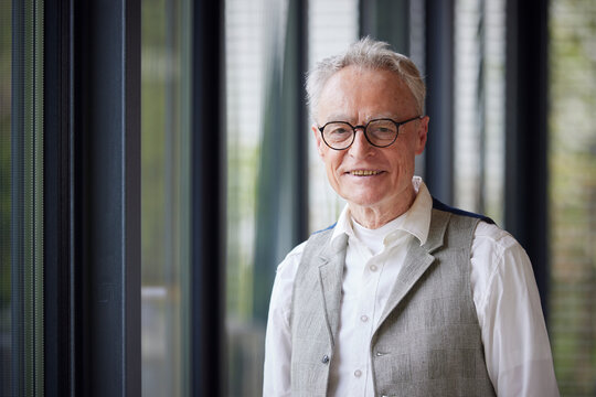 Portrait of smiling senior man at home