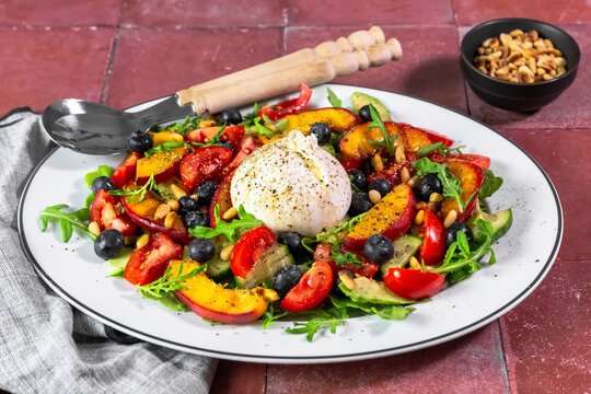 Fresh summer burrata salad with nectarine and blueberry